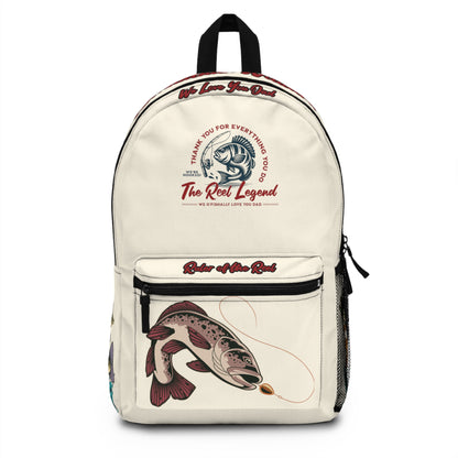 a cream backpack that has graphic of a bass fish and fishing reel, with words the reel legend we o'fishally love you dad, thank you for everything you do, we're hooked, ruler of the reel with last name of a person on the top